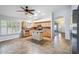 Eat-in kitchen featuring an island, tile floors, stainless steel appliances, and natural wood cabinets at 6659 W Oraibi Dr, Glendale, AZ 85308