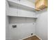 Laundry room with upper cabinet and utility connections at 6659 W Oraibi Dr, Glendale, AZ 85308