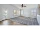 Bright room featuring tile and carpet, plantation shutters, and glass door at 6659 W Oraibi Dr, Glendale, AZ 85308