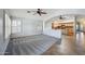Open-concept living area with tiled floors flowing into carpet, connecting the kitchen at 6659 W Oraibi Dr, Glendale, AZ 85308
