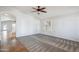 Bright living room features plush carpet, recessed lighting, and a large window with shutters at 6659 W Oraibi Dr, Glendale, AZ 85308