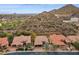View of a southwestern home nestled within the desert landscape at 7201 E Sandia Cir, Mesa, AZ 85207