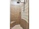 A tiled shower features a corner seat and glass block window for natural light at 7201 E Sandia Cir, Mesa, AZ 85207
