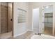 Relax in the gorgeous bathroom with walk in shower and shelving for towels and toiletries at 7201 E Sandia Cir, Mesa, AZ 85207