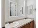 Bathroom vanity with double sinks and a large mirror at 7201 E Sandia Cir, Mesa, AZ 85207