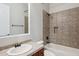 Bathroom with tiled shower and vanity with sink at 7201 E Sandia Cir, Mesa, AZ 85207