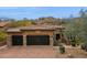 Charming home with a three-car garage, tile roof, and desert landscaping at 7201 E Sandia Cir, Mesa, AZ 85207