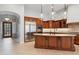 Gourmet kitchen boasts stainless steel appliances, custom cabinetry, and a center island at 7201 E Sandia Cir, Mesa, AZ 85207
