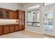 Additional cabinets with granite countertops and a view of the backyard at 7201 E Sandia Cir, Mesa, AZ 85207