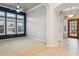 Open-concept living room with dark accent wall, natural lighting, and tile flooring at 7201 E Sandia Cir, Mesa, AZ 85207