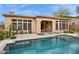 Backyard pool and patio with well-maintained desert landscaping at 7201 E Sandia Cir, Mesa, AZ 85207