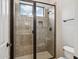 Shower stall with tiled walls and glass doors at 7201 E Sandia Cir, Mesa, AZ 85207