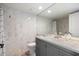Bathroom featuring modern vanity and marble-style tiling at 7245 E Buena Terra Way, Scottsdale, AZ 85250
