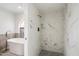 Marble tiled shower and freestanding tub create a spa-like bathroom at 7245 E Buena Terra Way, Scottsdale, AZ 85250