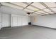 Spacious garage with utility door, closet and lighting at 7245 E Buena Terra Way, Scottsdale, AZ 85250