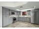 Updated kitchen with stainless steel appliances and grey cabinetry at 7245 E Buena Terra Way, Scottsdale, AZ 85250