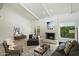Bright living room with white walls, fireplace, beamed ceilings and an array of stylish modern furniture at 7245 E Buena Terra Way, Scottsdale, AZ 85250