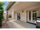 Covered patio featuring gas grill and access to the home's interior at 7245 E Buena Terra Way, Scottsdale, AZ 85250