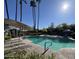 Community pool with lounge chairs and palm trees at 7245 E Buena Terra Way, Scottsdale, AZ 85250