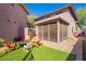 Exterior backyard features seating area with a firepit and covered patio at 7650 E Williams Dr # 1011, Scottsdale, AZ 85255