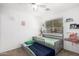 Charming bedroom with twin bed and decor at 7650 E Williams Dr # 1011, Scottsdale, AZ 85255