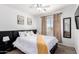 Inviting bedroom featuring a king bed, neutral decor, and ample natural light at 7650 E Williams Dr # 1011, Scottsdale, AZ 85255