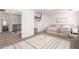 Bright bedroom features neutral tones, a large rug, and an updated aesthetic at 7650 E Williams Dr # 1011, Scottsdale, AZ 85255