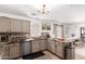 Spacious kitchen with stainless steel appliances, granite countertops, and adjacent breakfast nook at 7650 E Williams Dr # 1011, Scottsdale, AZ 85255