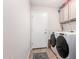 Updated laundry room area features new washer and dryer machines plus storage space at 7650 E Williams Dr # 1011, Scottsdale, AZ 85255