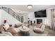 Stylish living room featuring a modern fireplace, sleek furniture, and plenty of natural light at 7650 E Williams Dr # 1011, Scottsdale, AZ 85255
