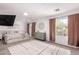 Open and airy main bedroom with large windows, plush carpet, and a king-size bed at 7650 E Williams Dr # 1011, Scottsdale, AZ 85255