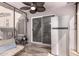 Covered patio area with stainless steel refrigerator and lounge area at 7650 E Williams Dr # 1011, Scottsdale, AZ 85255