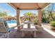 Outdoor seating area overlooking the community pool at 7650 E Williams Dr # 1011, Scottsdale, AZ 85255