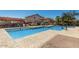 Community pool featuring clear blue water and safety rails at 7650 E Williams Dr # 1011, Scottsdale, AZ 85255