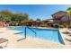 Community pool with ample seating and shade at 7650 E Williams Dr # 1011, Scottsdale, AZ 85255