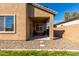 Backyard patio area with lawn and two-story home with brown trim at 811 E Gold Dust Way, San Tan Valley, AZ 85143