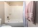 Bright and clean bathroom features a white tub and a shower with neutral wall accents at 811 E Gold Dust Way, San Tan Valley, AZ 85143