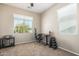 Bedroom features a window with blinds, an office chair, a desk, and a weight rack at 811 E Gold Dust Way, San Tan Valley, AZ 85143