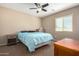 Neutral-toned bedroom featuring a fan, with simple decor creating a calm and inviting atmosphere at 811 E Gold Dust Way, San Tan Valley, AZ 85143