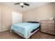Comfortable bedroom with a closet, dresser, and ceiling fan for functional living at 811 E Gold Dust Way, San Tan Valley, AZ 85143