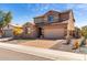 Charming two-story home boasting a well-manicured lawn, a paved driveway, and an attached two-car garage at 811 E Gold Dust Way, San Tan Valley, AZ 85143