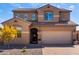 Inviting two-story home featuring a neutral-toned exterior, well-maintained landscaping, and a spacious two-car garage at 811 E Gold Dust Way, San Tan Valley, AZ 85143