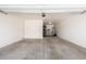 Spacious two-car garage with white walls and a concrete floor at 811 E Gold Dust Way, San Tan Valley, AZ 85143