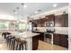 Stylish kitchen featuring a large island with seating, stainless steel appliances, and ample cabinet space at 811 E Gold Dust Way, San Tan Valley, AZ 85143