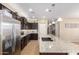 Well-appointed kitchen with a large island, modern stainless steel appliances, and ample storage, designed for functionality at 811 E Gold Dust Way, San Tan Valley, AZ 85143