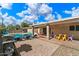 Spacious backyard with a pool, patio, lounge chairs, grill, and outdoor dining area at 8209 E Heatherbrae Ave, Scottsdale, AZ 85251