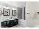 Modern bathroom features double sinks, sleek vanity, and a separate tub with stylish tile surround at 8209 E Heatherbrae Ave, Scottsdale, AZ 85251