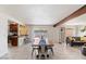 Cozy dining area with a wooden table, modern chairs, and a view of the outdoor space at 8209 E Heatherbrae Ave, Scottsdale, AZ 85251