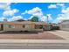 Charming single-story home with well-maintained landscaping and a cozy front porch area at 8209 E Heatherbrae Ave, Scottsdale, AZ 85251