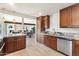 Modern kitchen featuring granite countertops, stainless steel appliances, and open layout at 8209 E Heatherbrae Ave, Scottsdale, AZ 85251